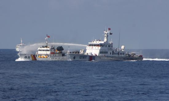 A China Coast Guard ship uses water cannons on a Vietnamese marine surveillance ship in the South China Sea. China has been able to advance its agenda through aggressive moves that mostly have failed to produce a serious U.S. response. It might not embark on war because it has no need to.
